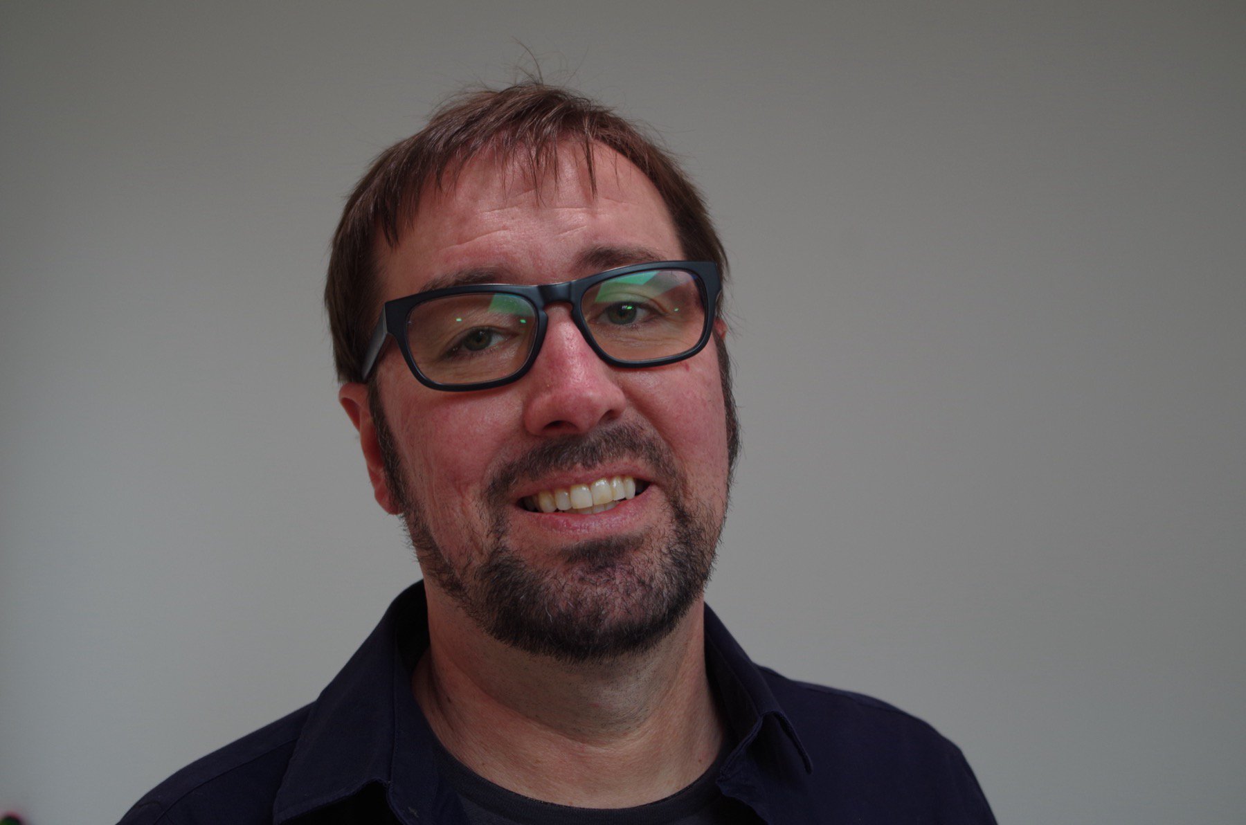 Sean, the founder of CodePilot, with a beard against a gray background.